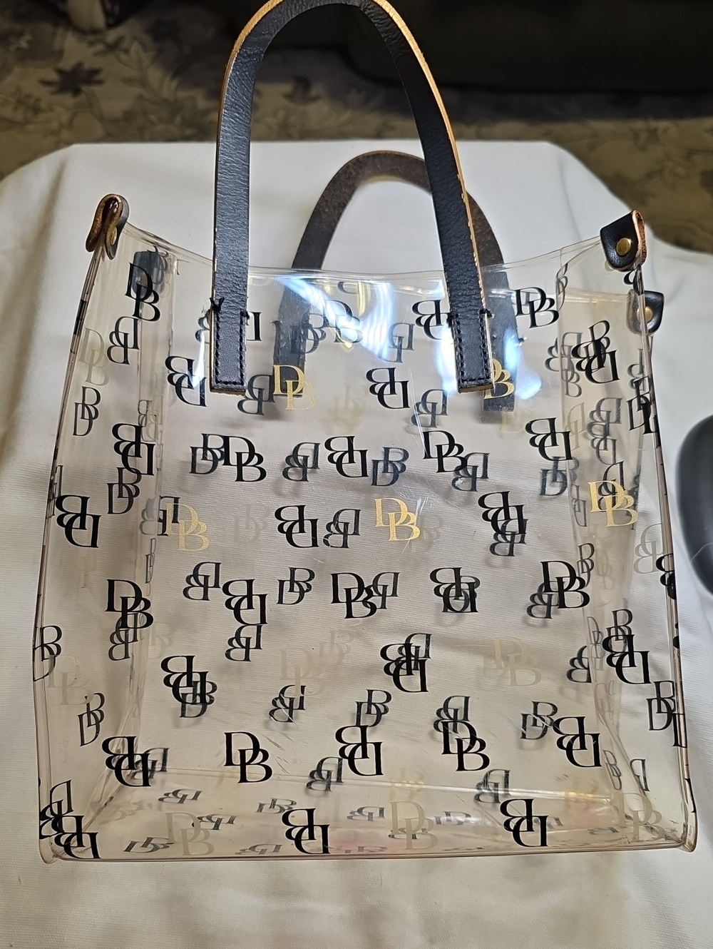 Dooney & Bourke Clear Logo Tote with Black Handles and Gold Accents